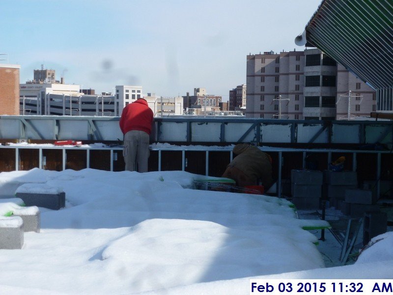 Aligning the stone panels at the lower roof Facing East